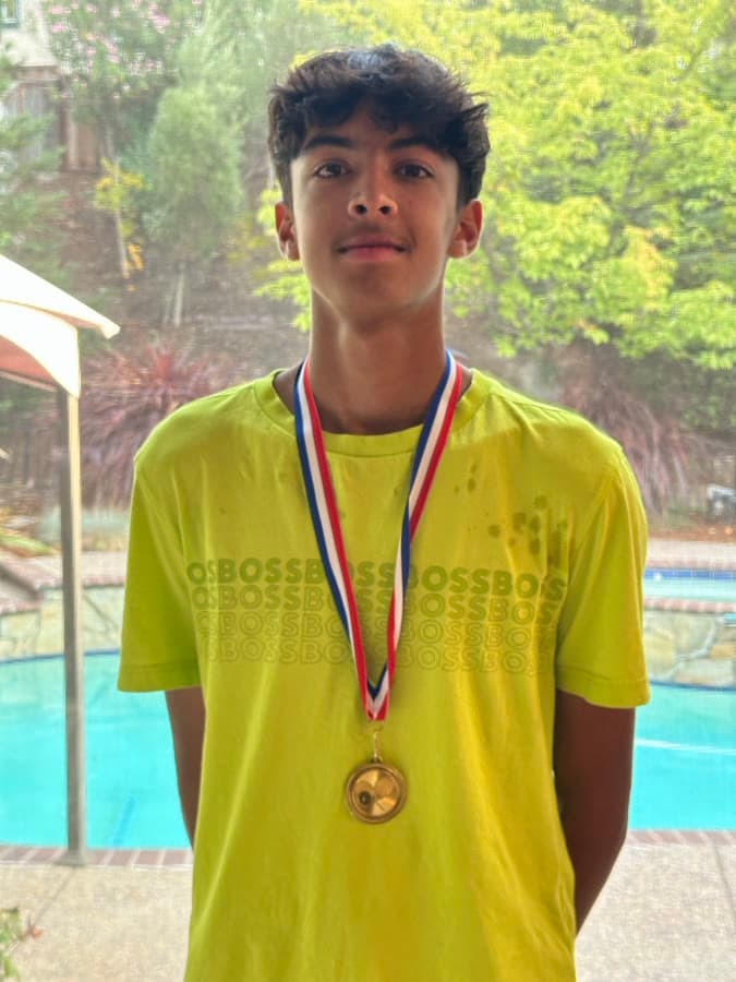 Arjan wearing a tournament medal